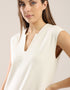 Sleeveless long dress with side slits